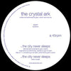 the album cover for Crystal Ark - The City Never Sleeps
