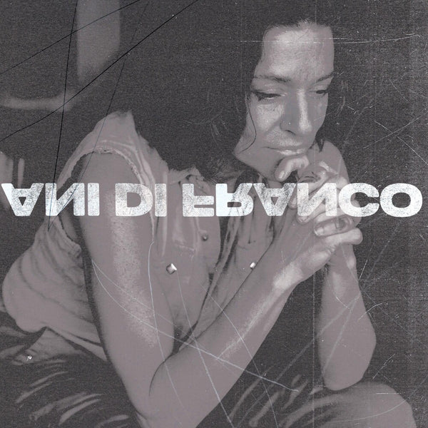 the album cover for ANI DIFRANCO - UNPRECEDENTED SH!T [INDIE EXCLUSIVE COKE BOTTLE CLEAR LP]