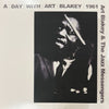 the album cover for Art Blakey &amp; The Jazz Messengers - A Day With Art Blakey 1961 [RSD Essential Indie Exclusive Metallic Silver ]